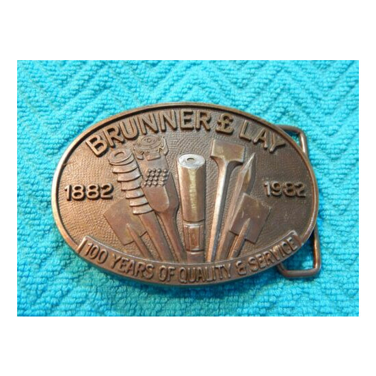 Vintage 1982 BRUNNER & LAY 100th Anniversary Belt Buckle - Pneumatic Chisels  image {1}