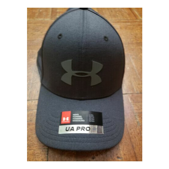 Under Armour hat and shorts image {1}