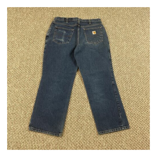 Carhartt FR Jeans size 34x28 Dark Wash Denim Work Pants - Pre-owned image {1}